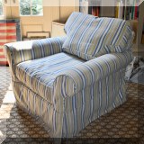 F82. Slipcovered Crate & Barrel club chair. 